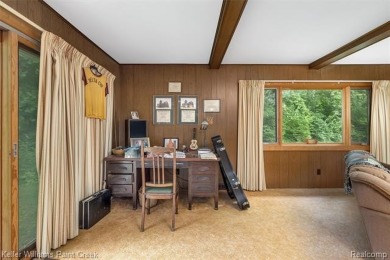 Step into this one-of-a-kind mid-century modern home tucked away on Kensington Metropark Golf Course in Michigan - for sale on GolfHomes.com, golf home, golf lot
