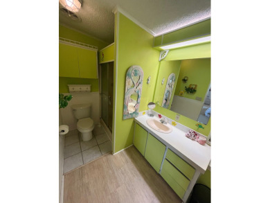 Welcome to this charming two-bedroom, two-bath home located in on Pine Lakes Country Club in Florida - for sale on GolfHomes.com, golf home, golf lot