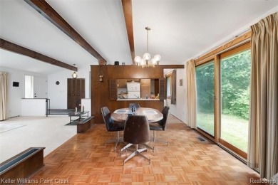 Step into this one-of-a-kind mid-century modern home tucked away on Kensington Metropark Golf Course in Michigan - for sale on GolfHomes.com, golf home, golf lot