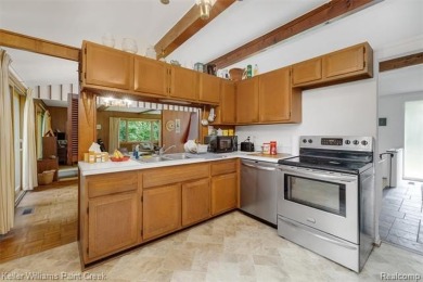 Step into this one-of-a-kind mid-century modern home tucked away on Kensington Metropark Golf Course in Michigan - for sale on GolfHomes.com, golf home, golf lot
