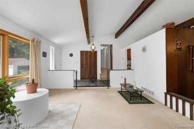 Step into this one-of-a-kind mid-century modern home tucked away on Kensington Metropark Golf Course in Michigan - for sale on GolfHomes.com, golf home, golf lot