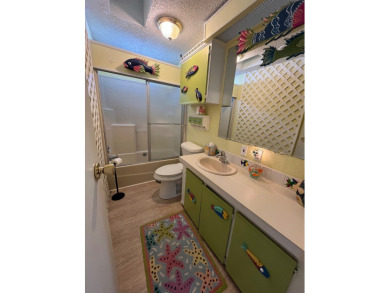 Welcome to this charming two-bedroom, two-bath home located in on Pine Lakes Country Club in Florida - for sale on GolfHomes.com, golf home, golf lot