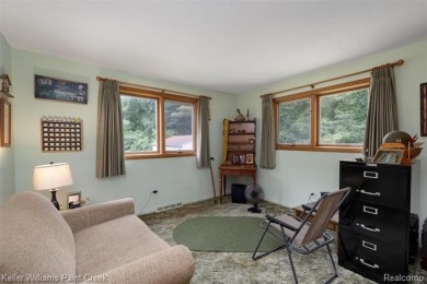 Step into this one-of-a-kind mid-century modern home tucked away on Kensington Metropark Golf Course in Michigan - for sale on GolfHomes.com, golf home, golf lot