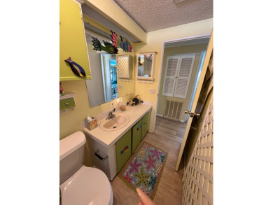 Welcome to this charming two-bedroom, two-bath home located in on Pine Lakes Country Club in Florida - for sale on GolfHomes.com, golf home, golf lot