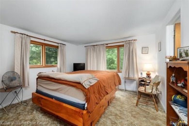 Step into this one-of-a-kind mid-century modern home tucked away on Kensington Metropark Golf Course in Michigan - for sale on GolfHomes.com, golf home, golf lot