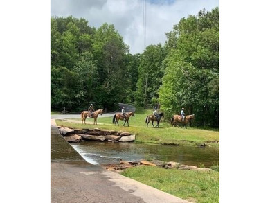 This .96 acre lot slopes gently down and should have a good view on Bent Tree Golf Course in Georgia - for sale on GolfHomes.com, golf home, golf lot