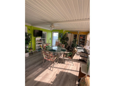 Welcome to this charming two-bedroom, two-bath home located in on Pine Lakes Country Club in Florida - for sale on GolfHomes.com, golf home, golf lot