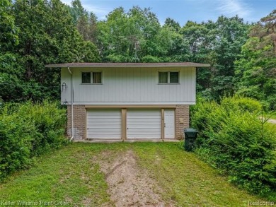 Step into this one-of-a-kind mid-century modern home tucked away on Kensington Metropark Golf Course in Michigan - for sale on GolfHomes.com, golf home, golf lot