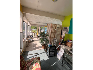 Welcome to this charming two-bedroom, two-bath home located in on Pine Lakes Country Club in Florida - for sale on GolfHomes.com, golf home, golf lot