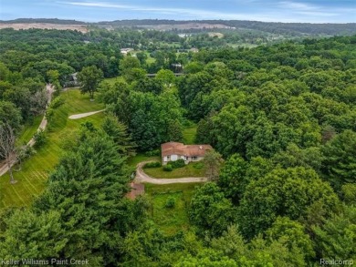 Step into this one-of-a-kind mid-century modern home tucked away on Kensington Metropark Golf Course in Michigan - for sale on GolfHomes.com, golf home, golf lot