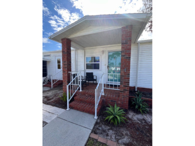 Welcome to this charming two-bedroom, two-bath home located in on Pine Lakes Country Club in Florida - for sale on GolfHomes.com, golf home, golf lot