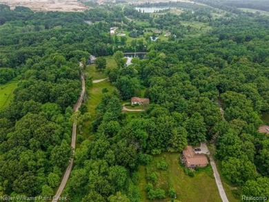 Step into this one-of-a-kind mid-century modern home tucked away on Kensington Metropark Golf Course in Michigan - for sale on GolfHomes.com, golf home, golf lot