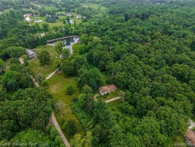 Step into this one-of-a-kind mid-century modern home tucked away on Kensington Metropark Golf Course in Michigan - for sale on GolfHomes.com, golf home, golf lot