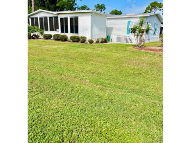 Welcome to this charming two-bedroom, two-bath home located in on Pine Lakes Country Club in Florida - for sale on GolfHomes.com, golf home, golf lot