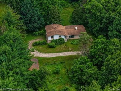 Step into this one-of-a-kind mid-century modern home tucked away on Kensington Metropark Golf Course in Michigan - for sale on GolfHomes.com, golf home, golf lot