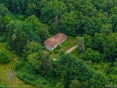Step into this one-of-a-kind mid-century modern home tucked away on Kensington Metropark Golf Course in Michigan - for sale on GolfHomes.com, golf home, golf lot