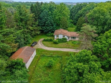 Step into this one-of-a-kind mid-century modern home tucked away on Kensington Metropark Golf Course in Michigan - for sale on GolfHomes.com, golf home, golf lot
