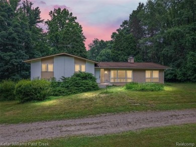 Step into this one-of-a-kind mid-century modern home tucked away on Kensington Metropark Golf Course in Michigan - for sale on GolfHomes.com, golf home, golf lot