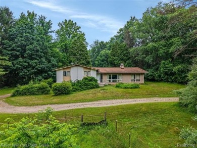 Step into this one-of-a-kind mid-century modern home tucked away on Kensington Metropark Golf Course in Michigan - for sale on GolfHomes.com, golf home, golf lot