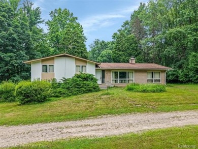 Step into this one-of-a-kind mid-century modern home tucked away on Kensington Metropark Golf Course in Michigan - for sale on GolfHomes.com, golf home, golf lot