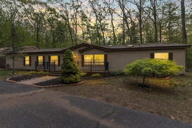 Welcome to this beautifully updated 4-bedroom, 2-bath ranch home on Indian River Golf Club in Michigan - for sale on GolfHomes.com, golf home, golf lot