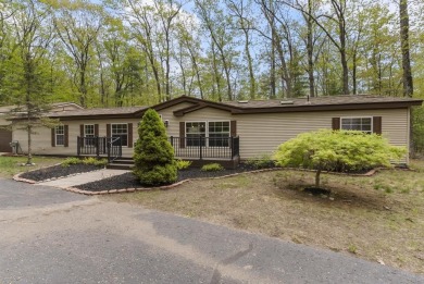 Welcome to this beautifully updated 4-bedroom, 2-bath ranch home on Indian River Golf Club in Michigan - for sale on GolfHomes.com, golf home, golf lot