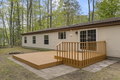 Welcome to this beautifully updated 4-bedroom, 2-bath ranch home on Indian River Golf Club in Michigan - for sale on GolfHomes.com, golf home, golf lot