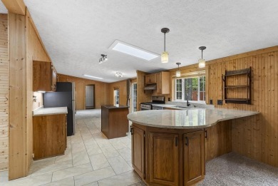 Welcome to this beautifully updated 4-bedroom, 2-bath ranch home on Indian River Golf Club in Michigan - for sale on GolfHomes.com, golf home, golf lot