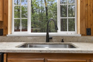Welcome to this beautifully updated 4-bedroom, 2-bath ranch home on Indian River Golf Club in Michigan - for sale on GolfHomes.com, golf home, golf lot
