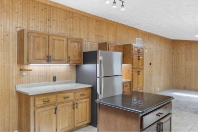 Welcome to this beautifully updated 4-bedroom, 2-bath ranch home on Indian River Golf Club in Michigan - for sale on GolfHomes.com, golf home, golf lot