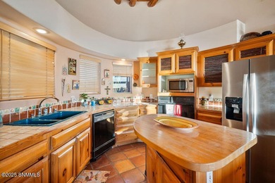 One of a kind Eddie Chavez home featuring original Pueblo style on New Mexico St Univ Golf Course in New Mexico - for sale on GolfHomes.com, golf home, golf lot