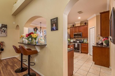 Exceptional and stunning executive pool home situated on a pond on Heritage Harbor Golf and Country Club in Florida - for sale on GolfHomes.com, golf home, golf lot