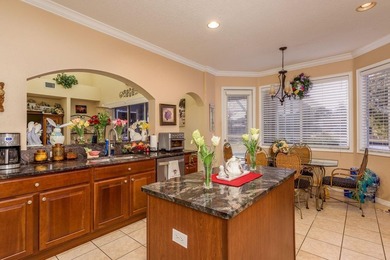 Exceptional and stunning executive pool home situated on a pond on Heritage Harbor Golf and Country Club in Florida - for sale on GolfHomes.com, golf home, golf lot