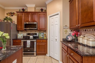 Exceptional and stunning executive pool home situated on a pond on Heritage Harbor Golf and Country Club in Florida - for sale on GolfHomes.com, golf home, golf lot