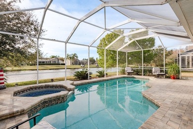Exceptional and stunning executive pool home situated on a pond on Heritage Harbor Golf and Country Club in Florida - for sale on GolfHomes.com, golf home, golf lot