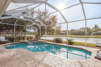 Exceptional and stunning executive pool home situated on a pond on Heritage Harbor Golf and Country Club in Florida - for sale on GolfHomes.com, golf home, golf lot