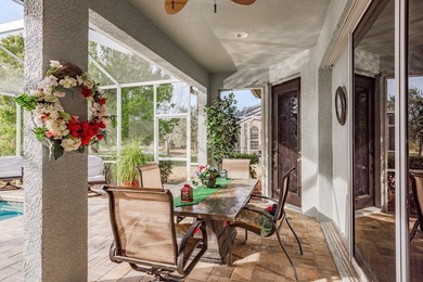 Exceptional and stunning executive pool home situated on a pond on Heritage Harbor Golf and Country Club in Florida - for sale on GolfHomes.com, golf home, golf lot