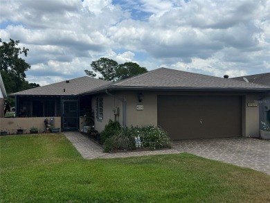 Located on a cul-de-sac, this 2 bedroom home overlooks a on Cypresswood Golf and Country Club in Florida - for sale on GolfHomes.com, golf home, golf lot
