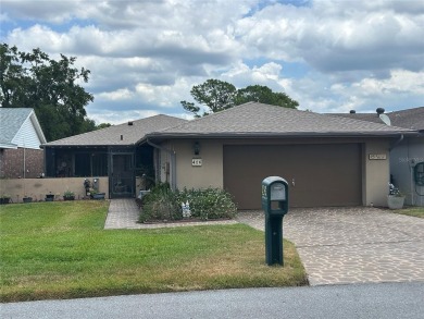 Located on a cul-de-sac, this 2 bedroom home overlooks a on Cypresswood Golf and Country Club in Florida - for sale on GolfHomes.com, golf home, golf lot