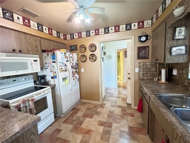 Located on a cul-de-sac, this 2 bedroom home overlooks a on Cypresswood Golf and Country Club in Florida - for sale on GolfHomes.com, golf home, golf lot