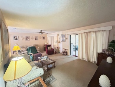 Located on a cul-de-sac, this 2 bedroom home overlooks a on Cypresswood Golf and Country Club in Florida - for sale on GolfHomes.com, golf home, golf lot