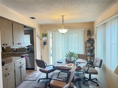 Located on a cul-de-sac, this 2 bedroom home overlooks a on Cypresswood Golf and Country Club in Florida - for sale on GolfHomes.com, golf home, golf lot