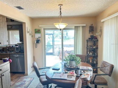 Located on a cul-de-sac, this 2 bedroom home overlooks a on Cypresswood Golf and Country Club in Florida - for sale on GolfHomes.com, golf home, golf lot