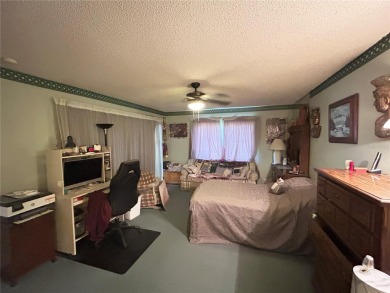 Located on a cul-de-sac, this 2 bedroom home overlooks a on Cypresswood Golf and Country Club in Florida - for sale on GolfHomes.com, golf home, golf lot
