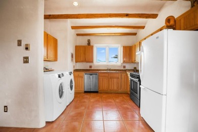 Authentic Adobe - Experience the charm and craftsmanship of true on Taos Country Club in New Mexico - for sale on GolfHomes.com, golf home, golf lot
