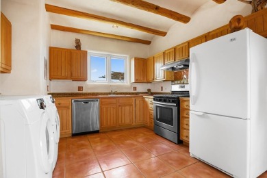 Authentic Adobe - Experience the charm and craftsmanship of true on Taos Country Club in New Mexico - for sale on GolfHomes.com, golf home, golf lot