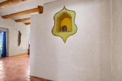 Authentic Adobe - Experience the charm and craftsmanship of true on Taos Country Club in New Mexico - for sale on GolfHomes.com, golf home, golf lot