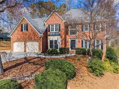 Welcome home to this timeless brick traditional nestled at the on Brookstone Golf and Country Club in Georgia - for sale on GolfHomes.com, golf home, golf lot