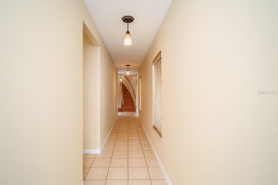 One or more photo(s) has been virtually staged. Nestled on a on Eastwood Golf Club in Florida - for sale on GolfHomes.com, golf home, golf lot