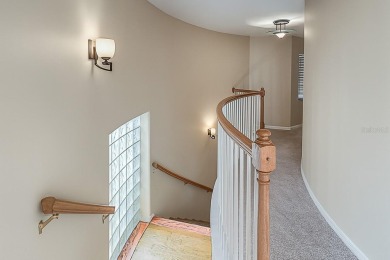 One or more photo(s) has been virtually staged. Nestled on a on Eastwood Golf Club in Florida - for sale on GolfHomes.com, golf home, golf lot